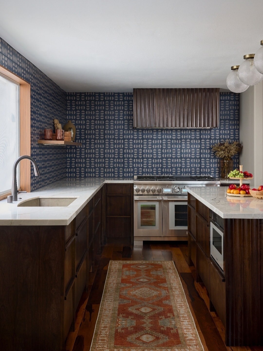 4. Navy Pattern Tile with Warm Wood Cabinetry - kitchen tile ideas