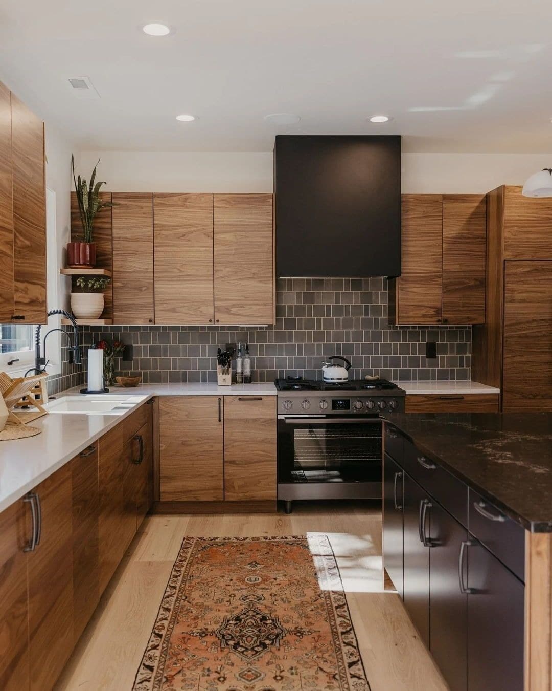 5. Walnut Cabinetry with Subtle Taupe Brick Tile - kitchen tile ideas