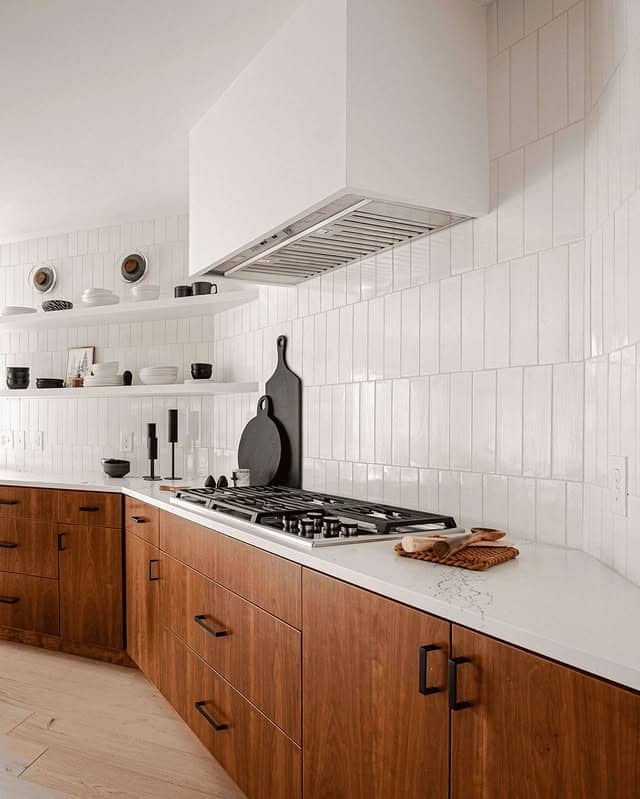 13. Vertical White Tile with Minimalist Wood Cabinetry - kitchen tile ideas