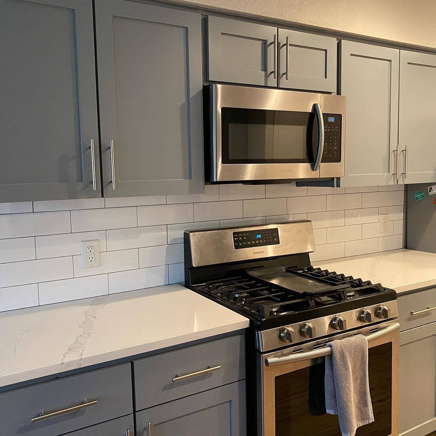 14. Classic White Subway Tile with Cool Gray Cabinets - kitchen tile ideas