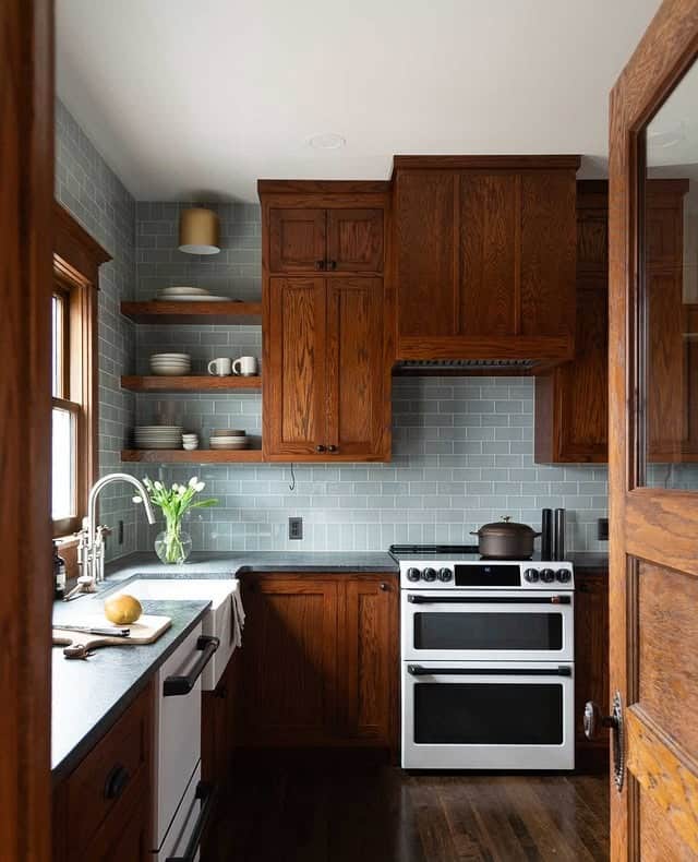15. Soft Blue Subway Tile with Rich Wood Cabinets - kitchen tile ideas