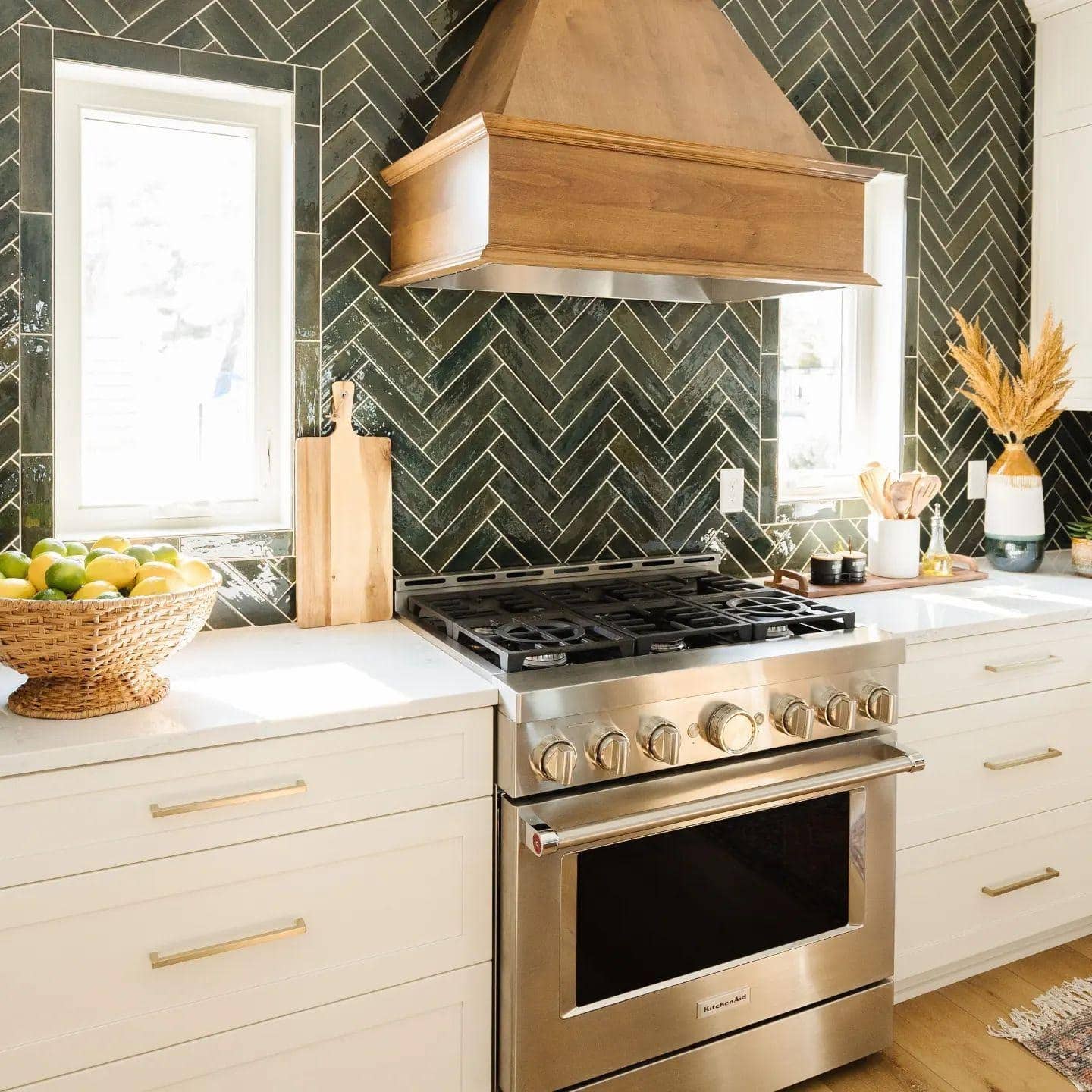 17. Dark Green Herringbone Tile with Natural Wood Hood - kitchen tile ideas