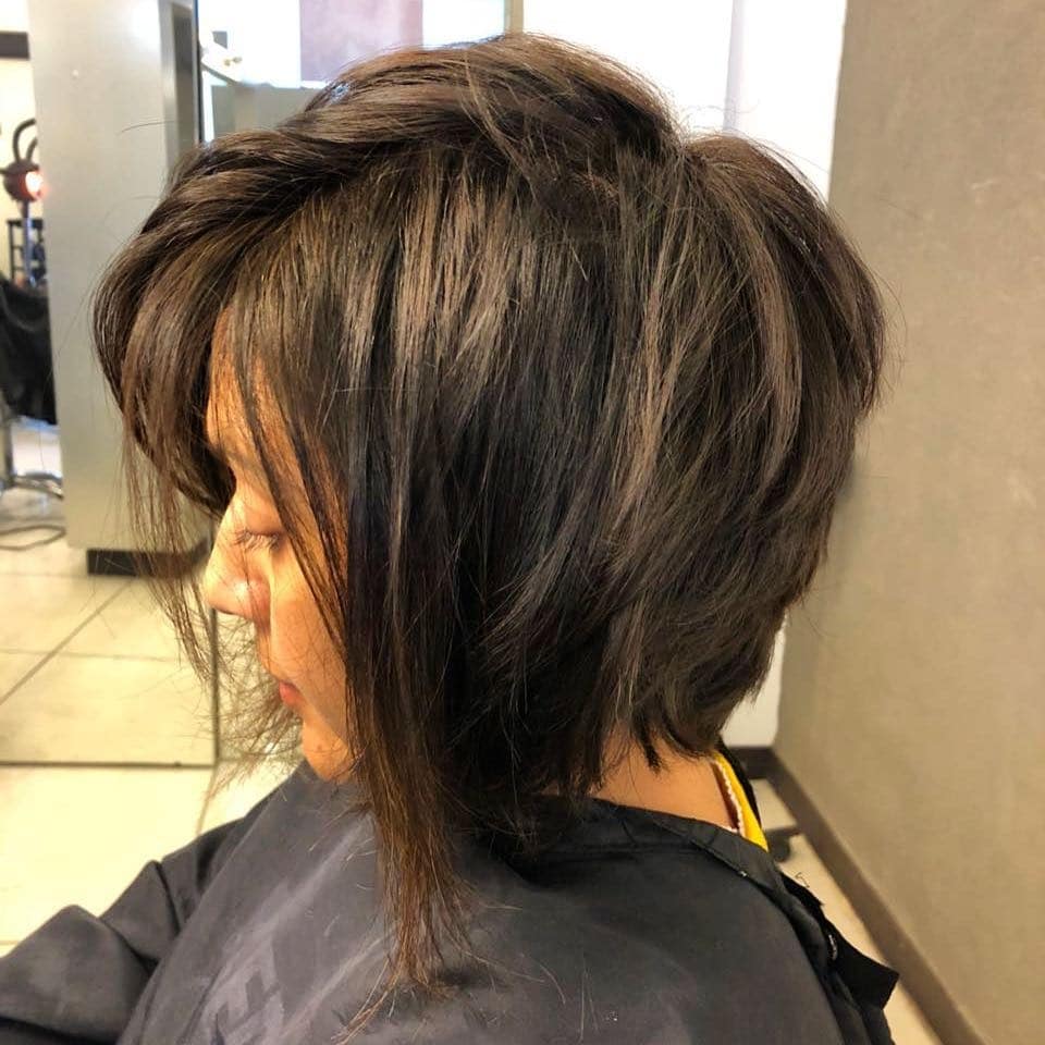 3. Feathered Short Bob with Subtle Golden Accents - Short Messy Hair For Women