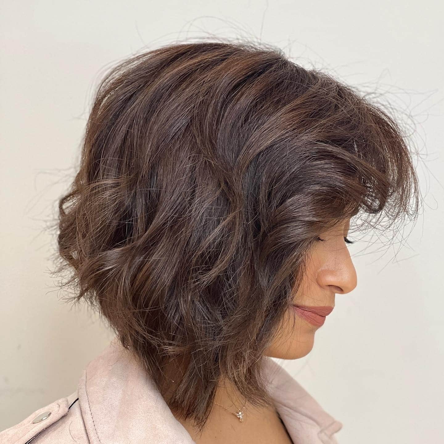 21. Layered Brunette Bob with Soft Feathered Volume - Short Messy Hair For Women