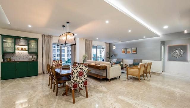 3. Open-Concept Living Room with Subtle Beige and Green Accents - large living room ideas