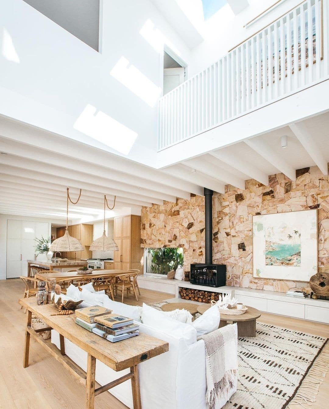 4. Light-Filled Living Room with Natural Wood and Stone Features - large living room ideas