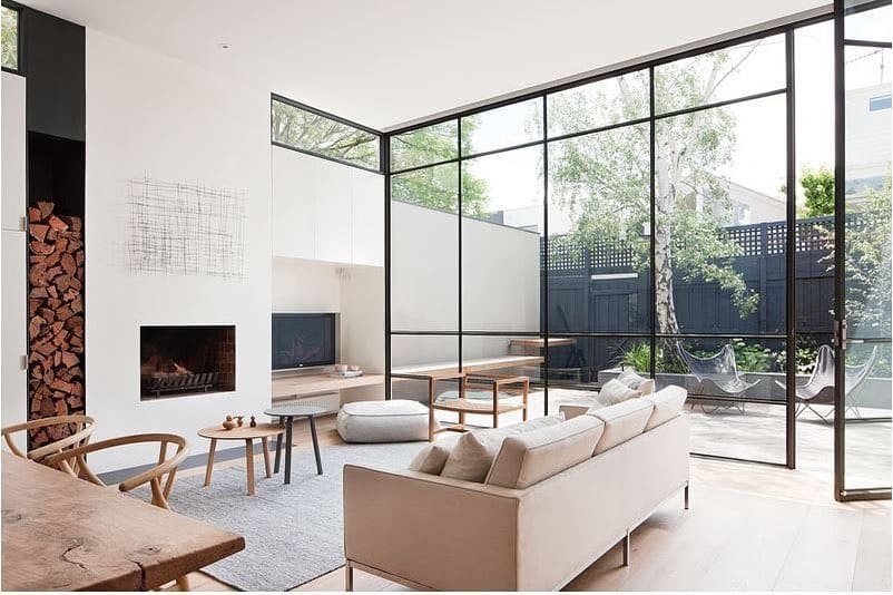 5. Minimal Glass-Wall Living Room with Soft Neutral Palette - large living room ideas