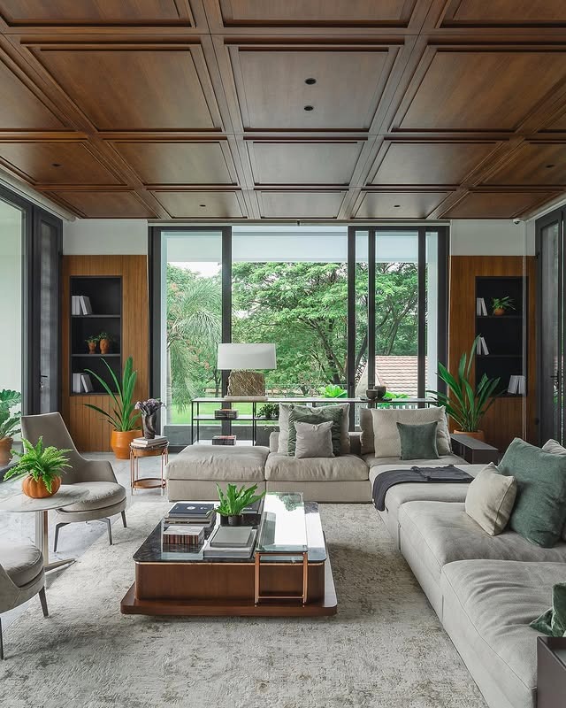 17. Nature-Inspired Living Room with Wood Paneling and Soft Greens - large living room ideas