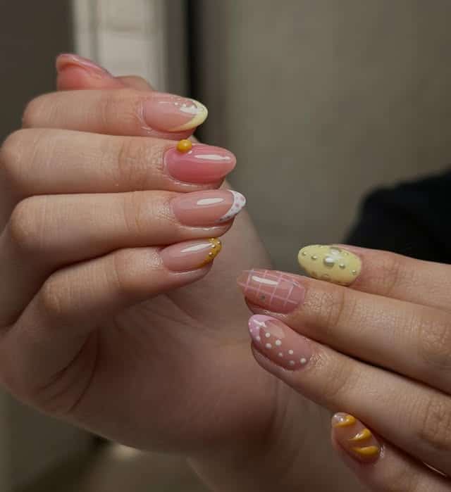 17. Mixed Pastel Pattern Almond Nails in Pink and Butter Yellow - nail art ideas