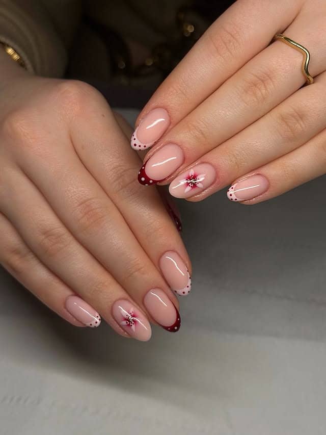 19. Nude Almond Nails with Burgundy Tips and Floral Accent - nail art ideas