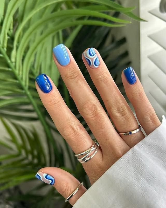 22. Glossy Blue Mixed Design Square Nails with Abstract Swirls - nail art ideas