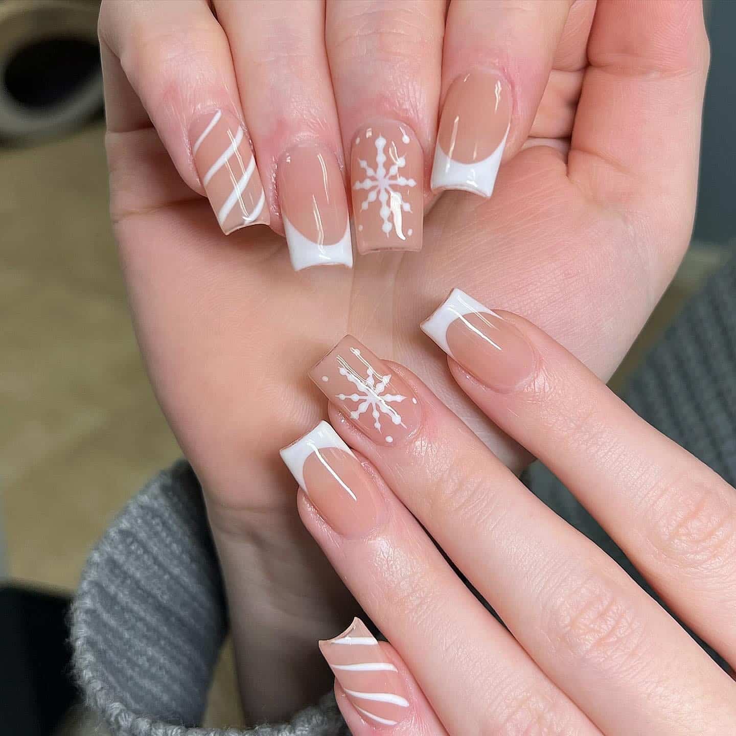 1. Classic French Snowflake Short Nails in Soft Nude and White - short winter nail ideas