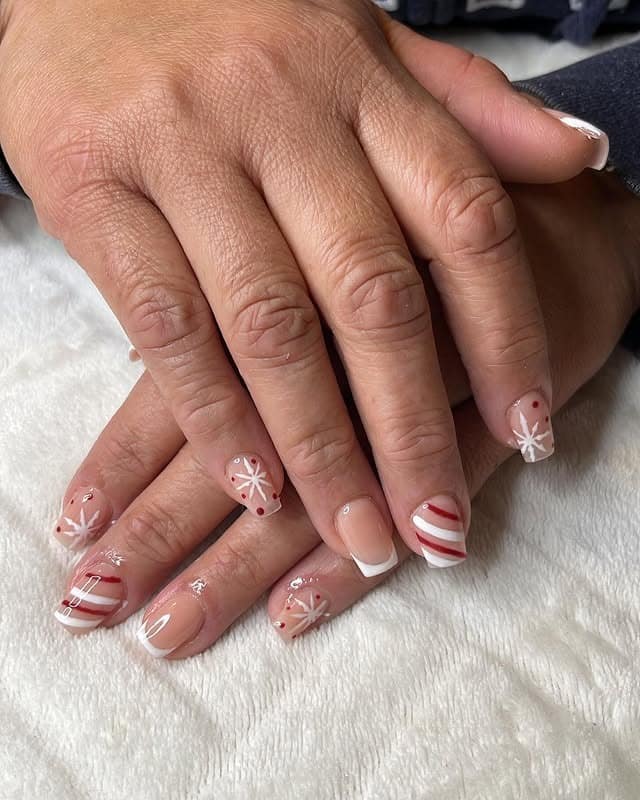 4. Short Holiday French Nails with Red and White Accents - short winter nail ideas
