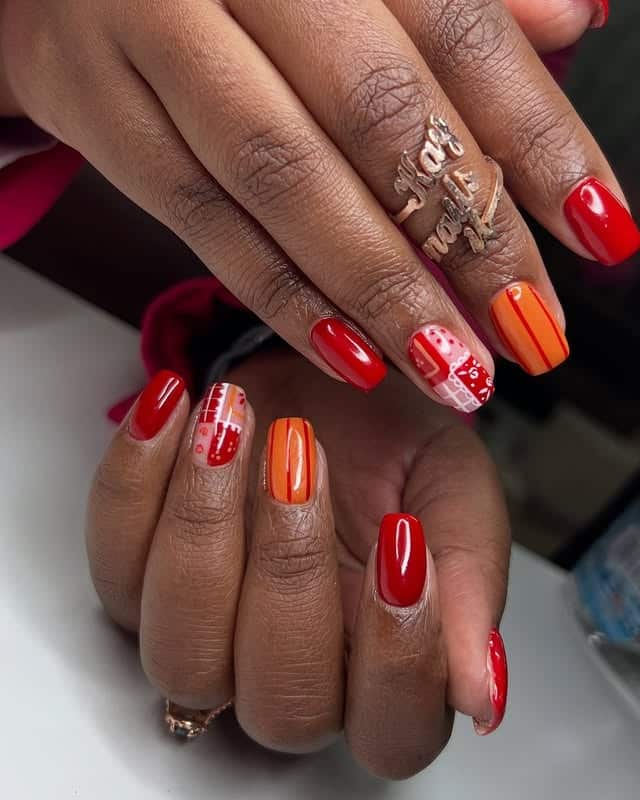 5. Glossy Red and Tangerine Winter Nails with Graphic Details - short winter nail ideas