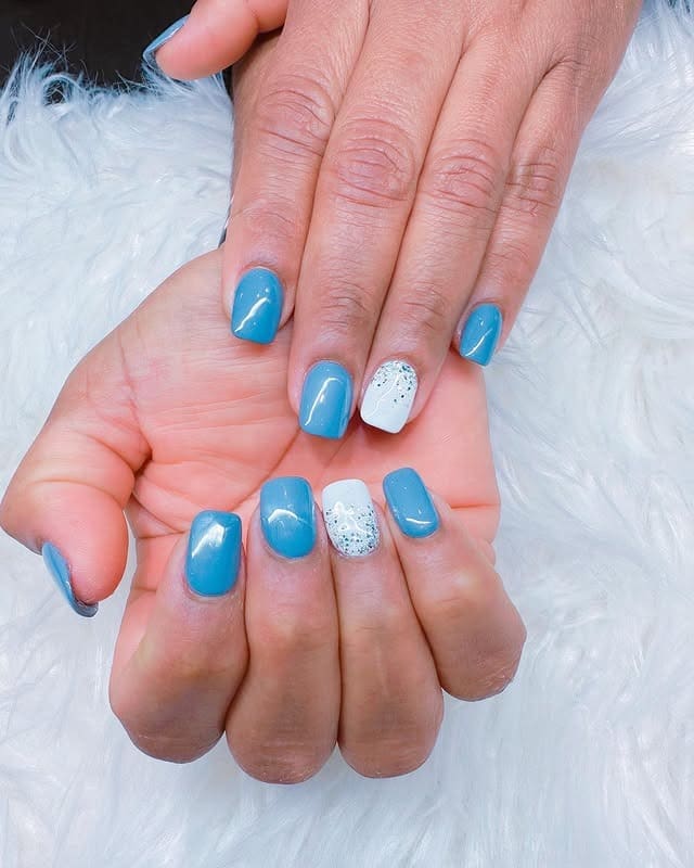 7. Cool Blue Short Nails with Minimal Glitter Accent - short winter nail ideas