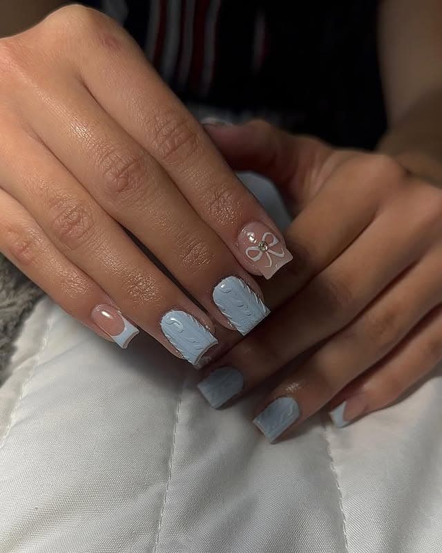8. Minimalist Blue and Nude Nails with 3D Floral Accent - short winter nail ideas