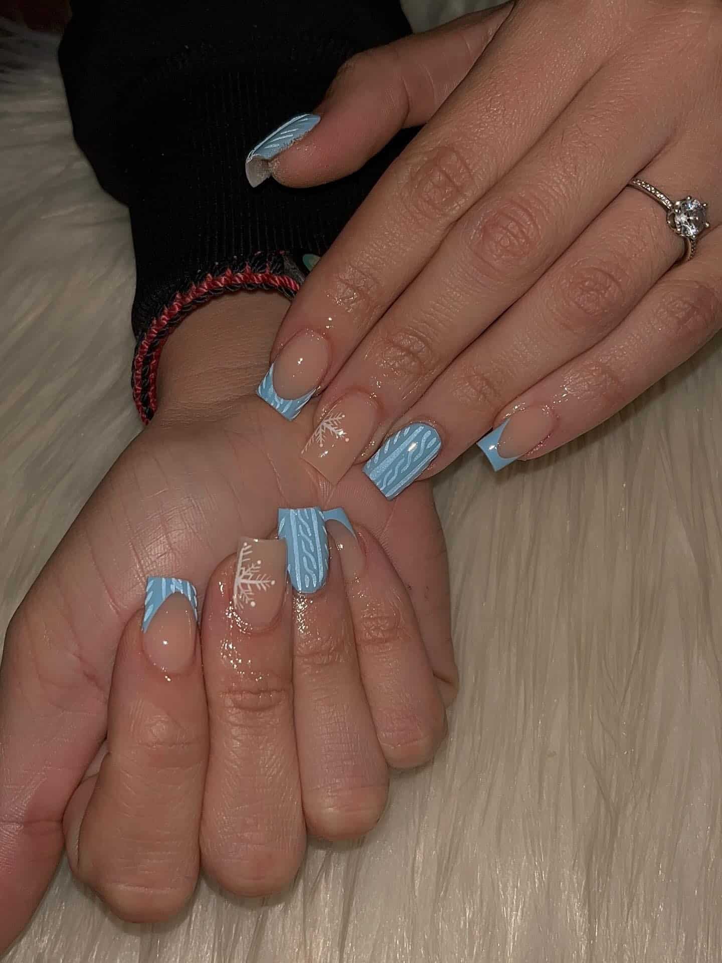 17. Baby Blue Sweater Texture Nails with Snowflake Detail - short winter nail ideas