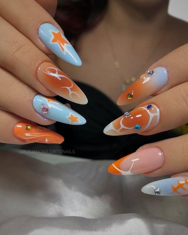 8. Retro Orange and Blue Graphic Almond Nails - grunge nail ideas