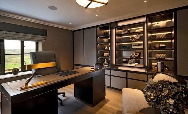 6. Sophisticated Dark Office with Ambient Lighting and Built-In Storage - home office ideas