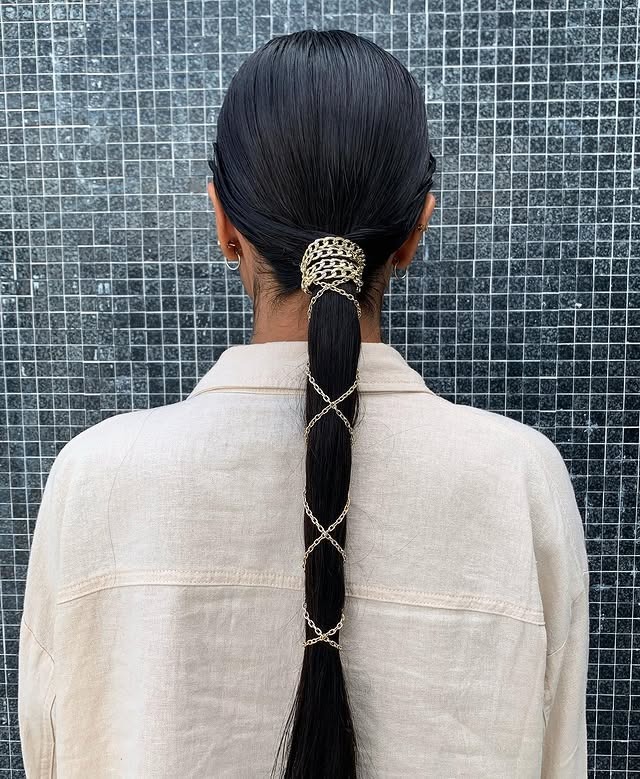 1. Sleek Jet Black Low Ponytail with Chain Wrap Detail - Sleek Low Ponytail