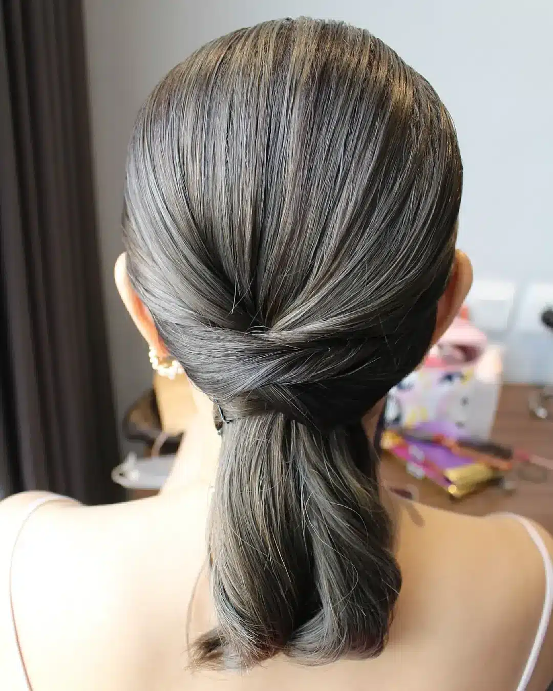 8. Ash Brown Low Ponytail with Twisted Wrap Accent - Sleek Low Ponytail