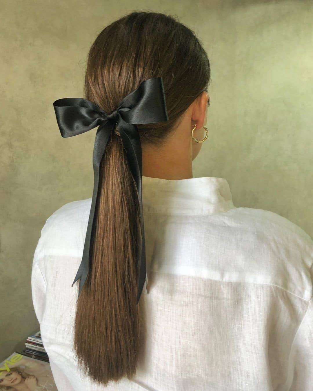 12. Medium Brown Low Ponytail with Black Ribbon Accent - Sleek Low Ponytail