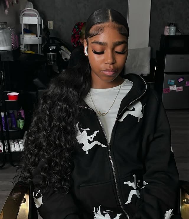 19. Black Sleek Low Ponytail with Side Part and Textured Length - Sleek Low Ponytail