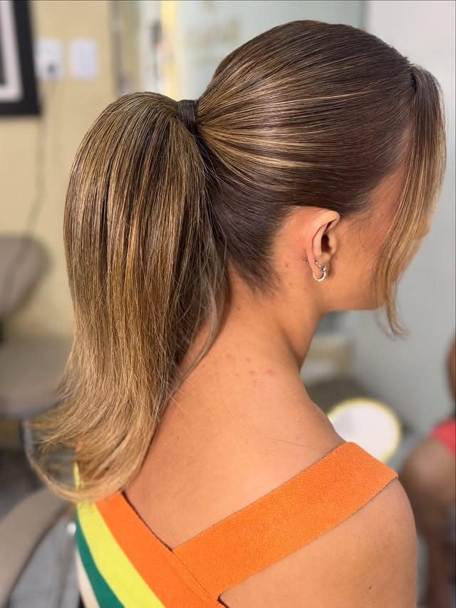 21. Honey Blonde Highlighted Sleek Low Ponytail with Soft Flip Ends - Sleek Low Ponytail
