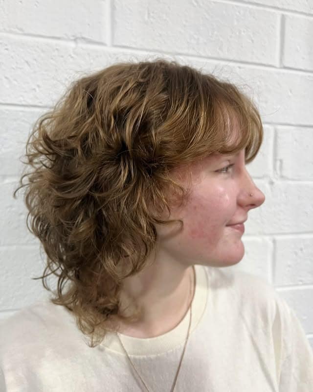 3. Curly Auburn Shag with Rounded Layers - Short Shaggy Haircuts
