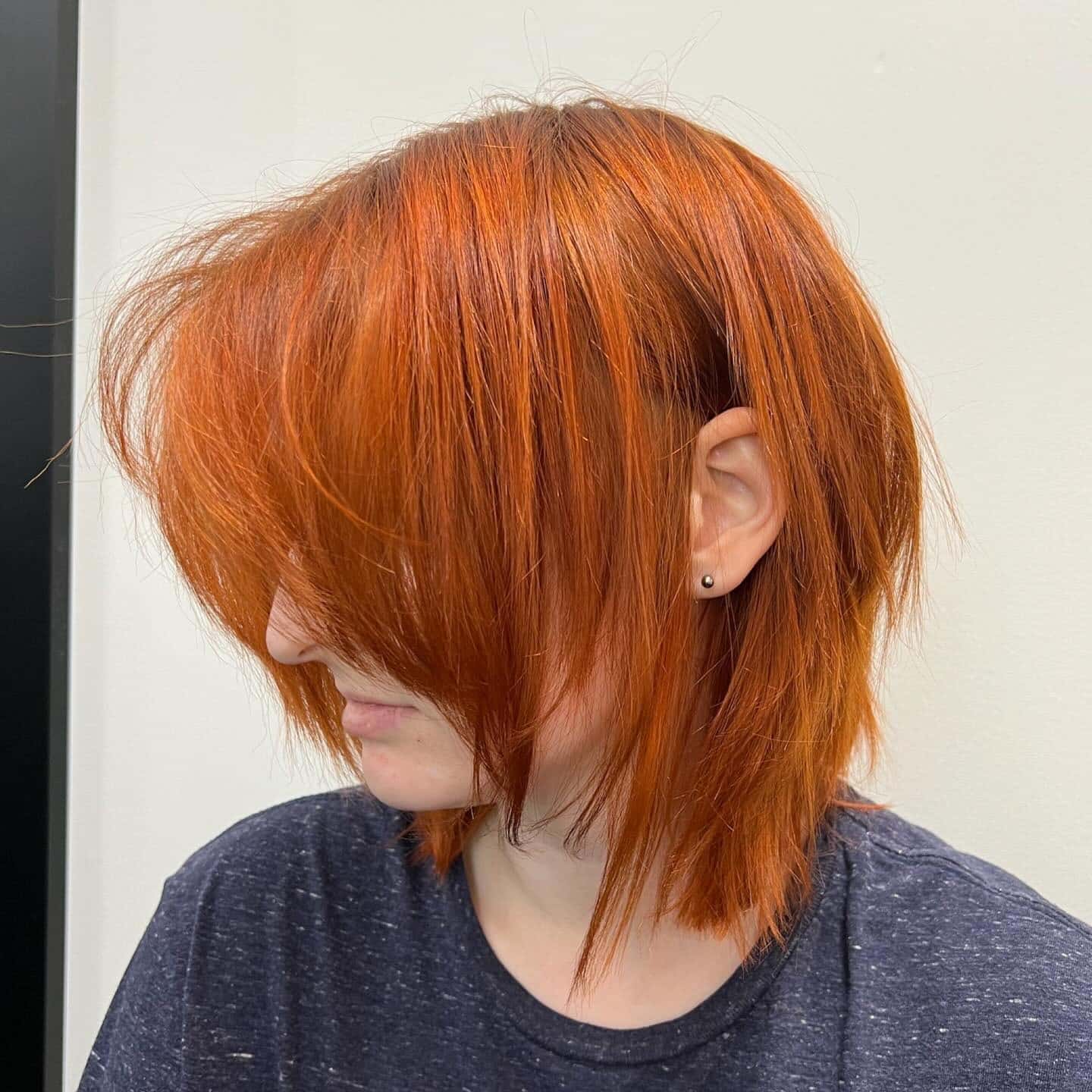9. Vibrant Orange Razor-Cut Shag - Short Shaggy Haircuts