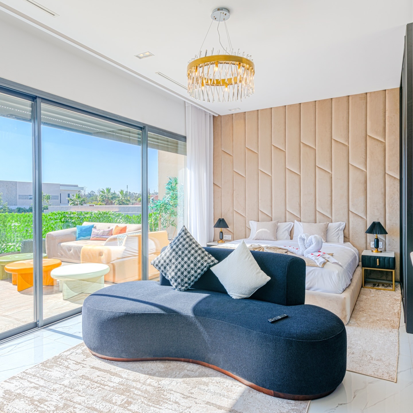 17. Contemporary Resort Bedroom with Textured Wall Panels - spa style bedroom ideas