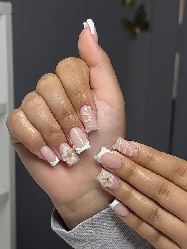 5. Minimal French Tips with 3D Floral Accents - short nail ideas