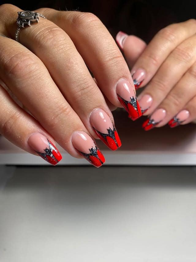 6. Red and Black Glitter Flame Tips - short nail ideas