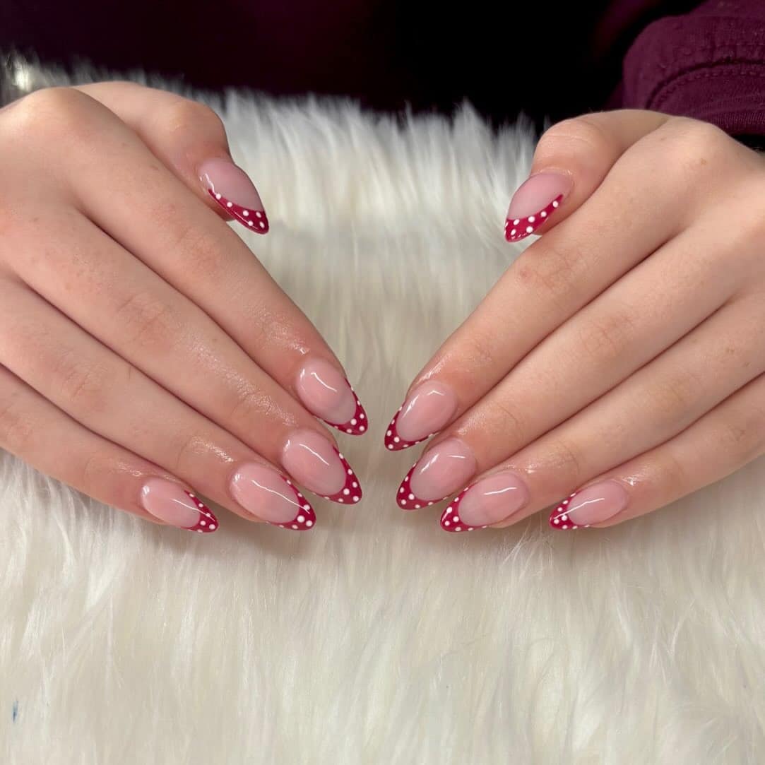 7. Almond French Tips with Red and White Polka Dots - short nail ideas