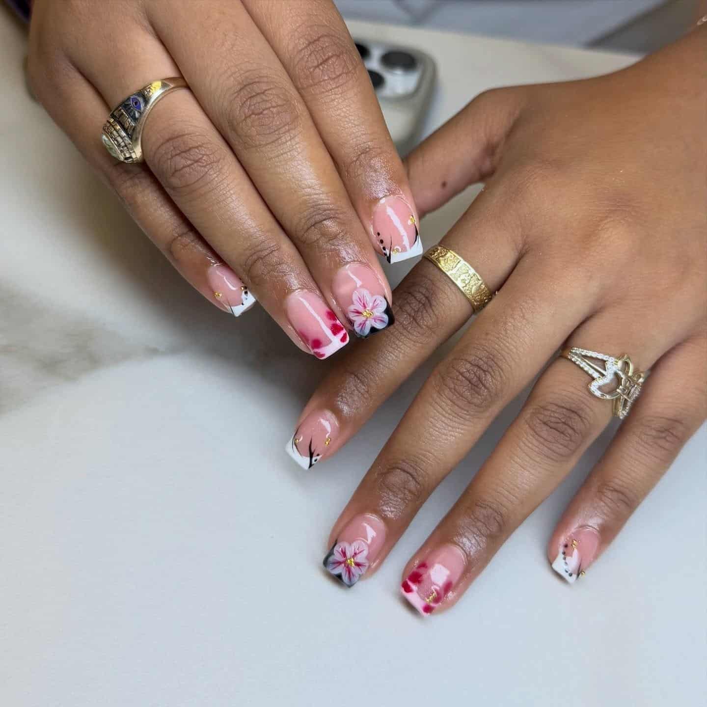 8. Short French Tips with Floral and Abstract Art - short nail ideas