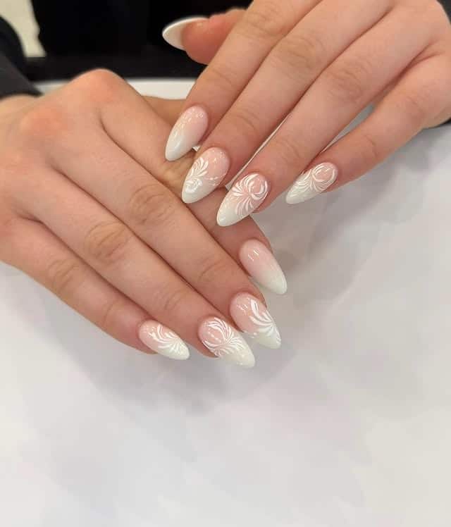 14. Milky White Almond Nails with Swirl Art - short nail ideas