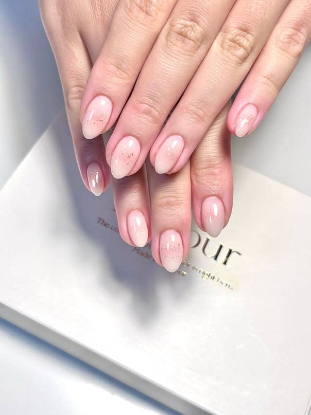 16. Blush Pink Almond Nails with Fine Glitter - short nail ideas