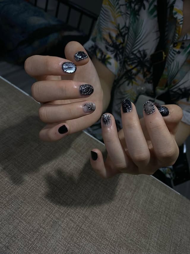 20. Black Short Nails with Metallic 3D Texture - short nail ideas