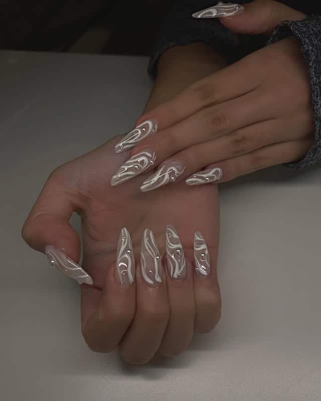 16. Neutral Taupe Long Nails with Abstract White Swirls - nail ideas for wedding