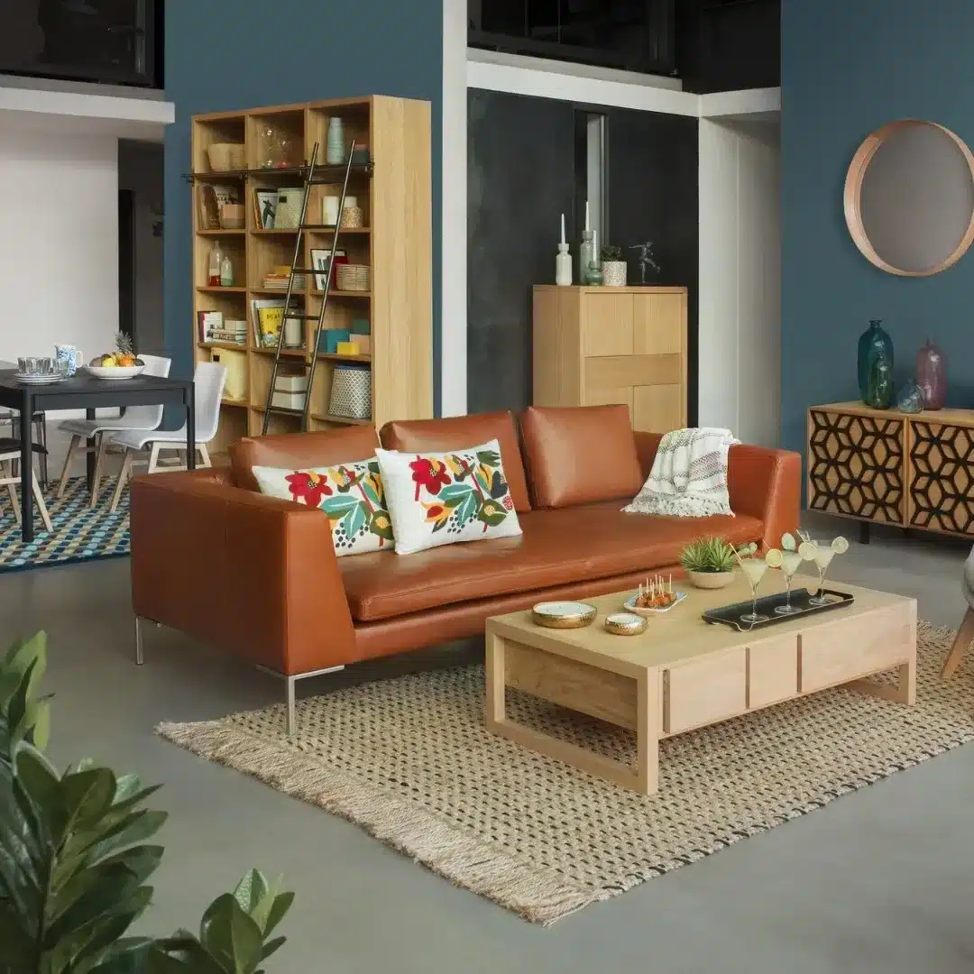 13. Caramel Leather Sofa with Teal Accent Wall - brown sofa living room ideas