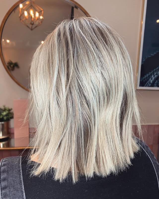 7. Blunt Razor Lob with Icy Blonde Tone - Razor Cut Hairstyles