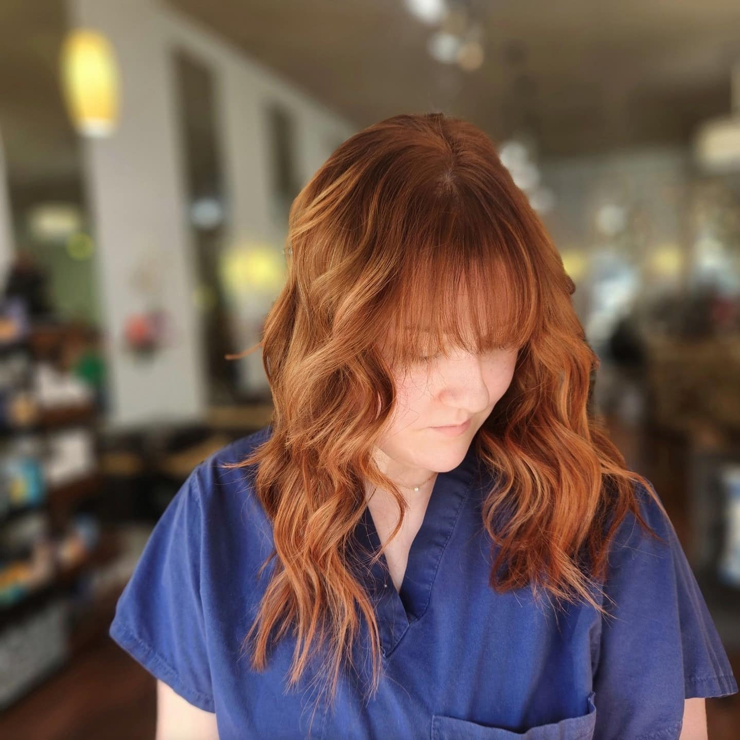 10. Layered Razor Cut with Rich Copper Waves and Fringe - Razor Cut Hairstyles