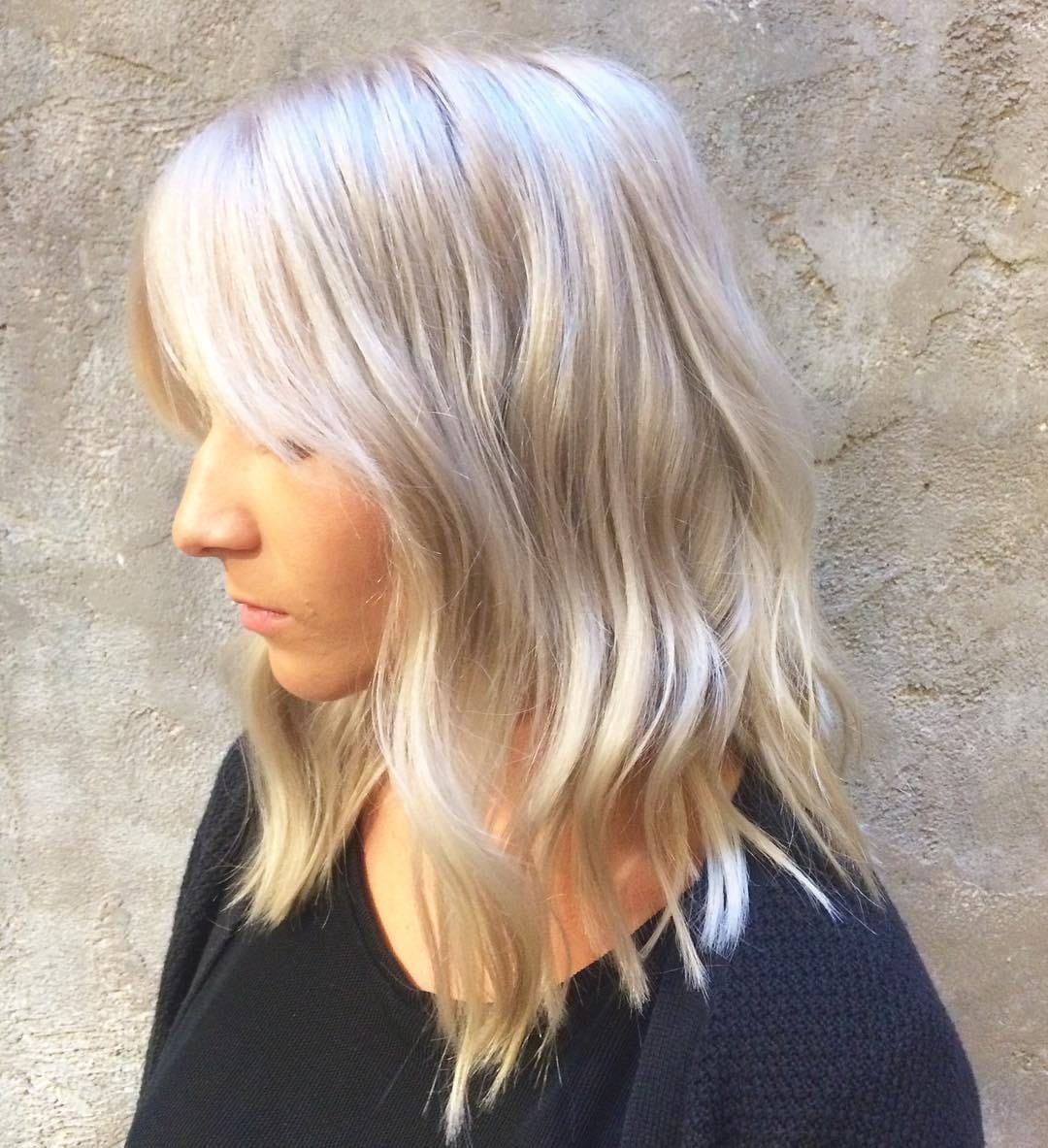 13. Feathered Razor Shag with Platinum Blonde Finish - Razor Cut Hairstyles