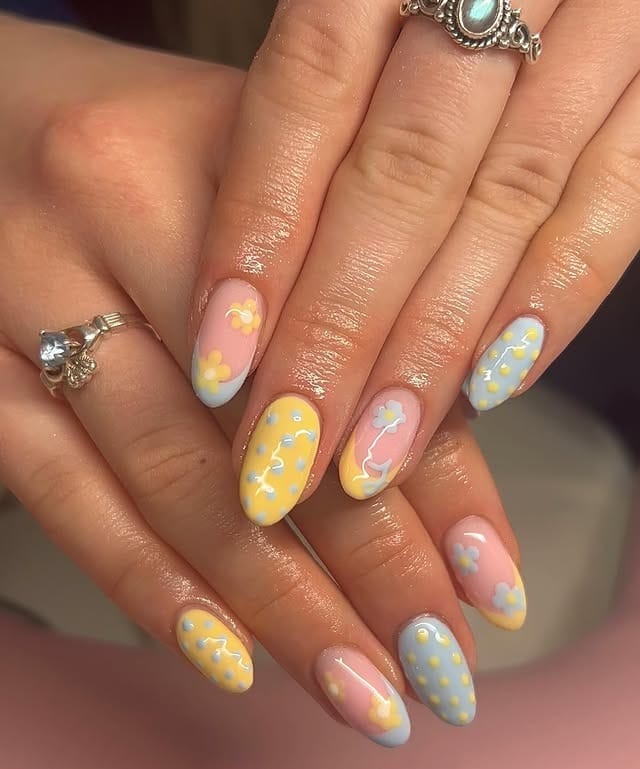4. Pastel Color Block Almond Nails with Floral Details - summer nail ideas