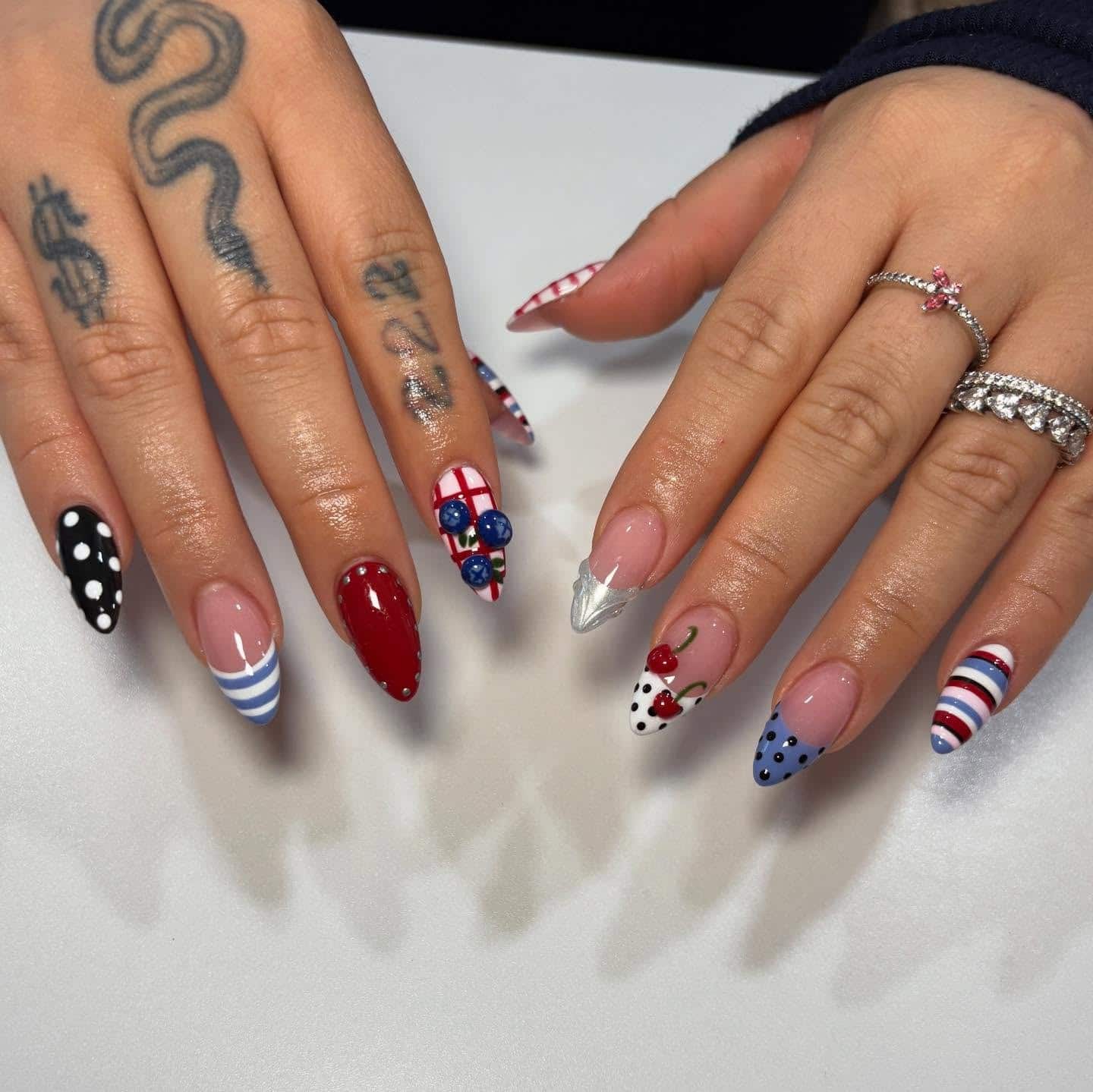 10. Cherry and Polka Dot Almond Nails with Red and Blue Accents - summer nail ideas