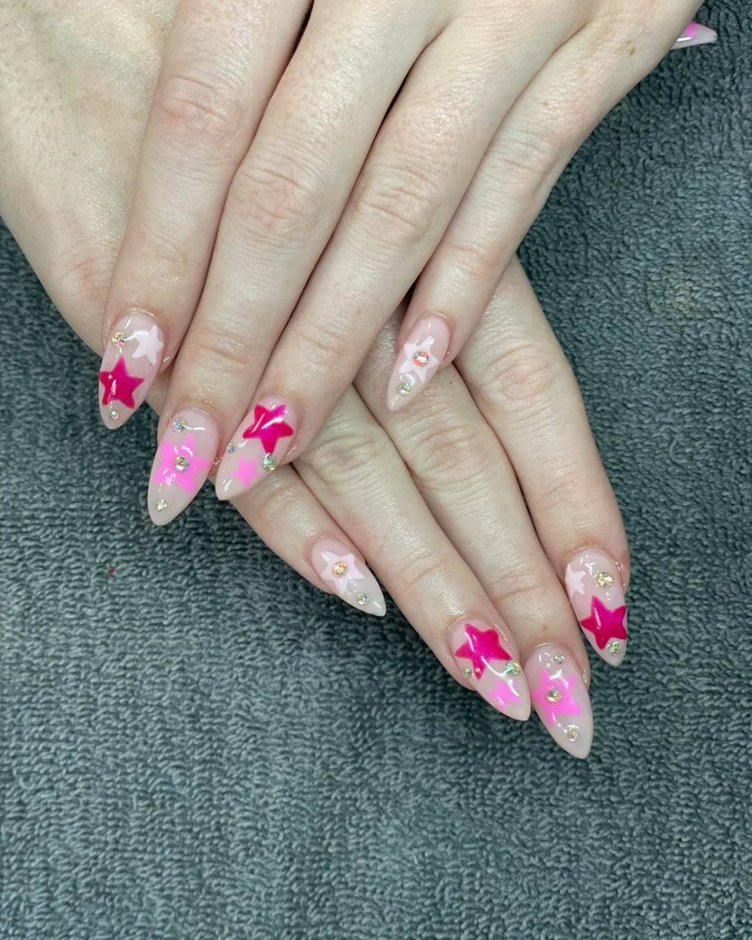 13. Pink Star Almond Nails with Rhinestone Details - summer nail ideas