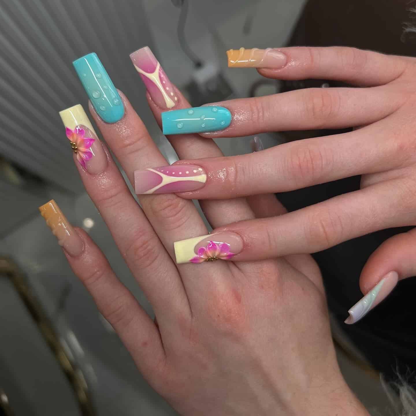 15. Pastel Color Block Coffin Nails with 3D Floral Accents - summer nail ideas