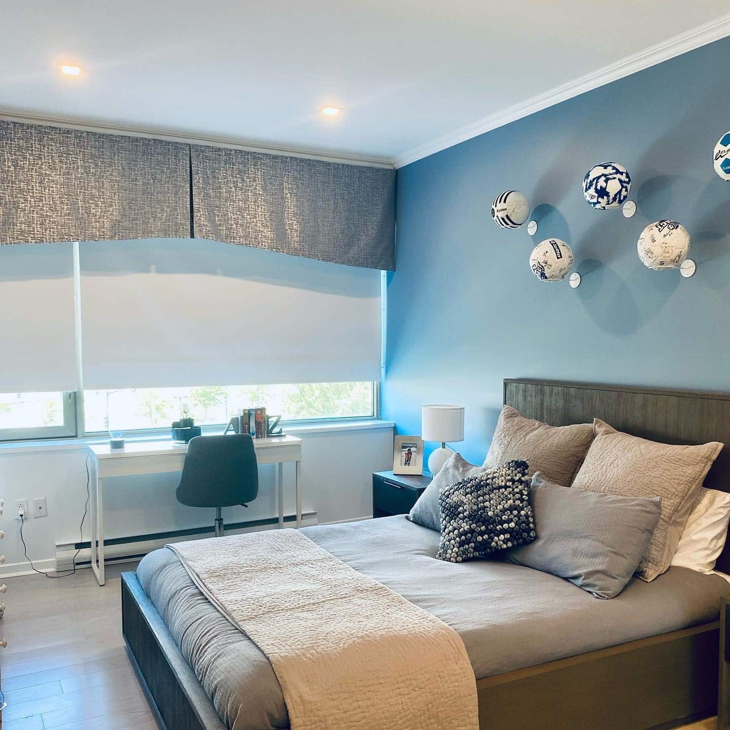 2. Soft Blue Soccer Accent Bedroom with Study Nook - soccer bedroom ideas