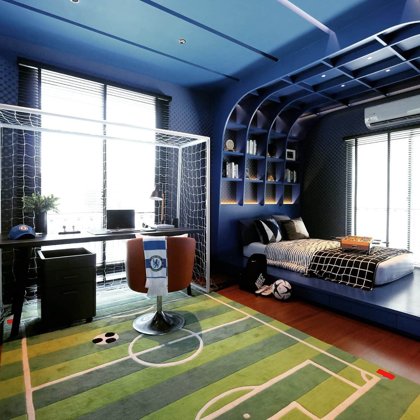 4. Modern Soccer Field Feature Bedroom in Navy - soccer bedroom ideas