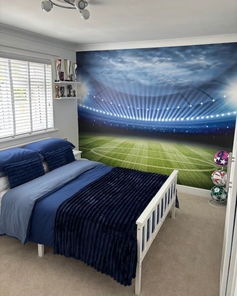 15. Stadium-Inspired Soccer Wall Mural Bedroom in Blue - soccer bedroom ideas
